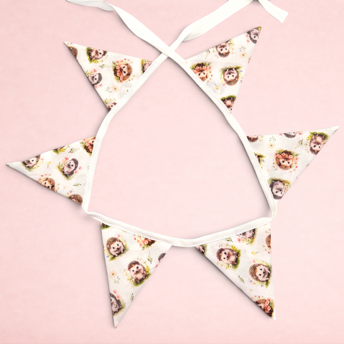 Darling Bun Shop bunting featuring an autumnal hedgehog and floral print on white fabric for small pet enclosures.