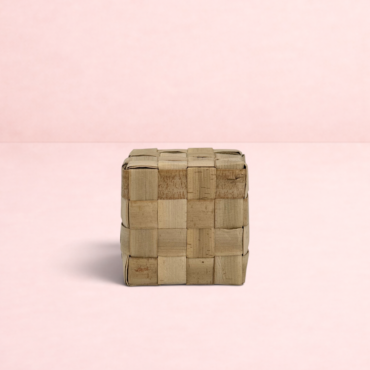 Darling Bun Shop natural woven palm leaf cube chew toy for rabbits and small pets on a white background
