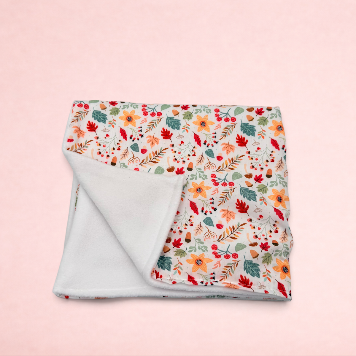 Darling Bun Shop handmade blanket with acorn and oak leaf print, featuring a soft white fleece lining.