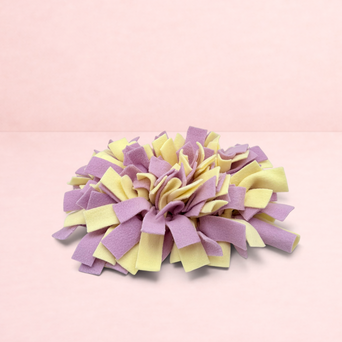 Darling Bun Shop purple and yellow fleece snuffle mat for small pets to forage for treats and slow down eating