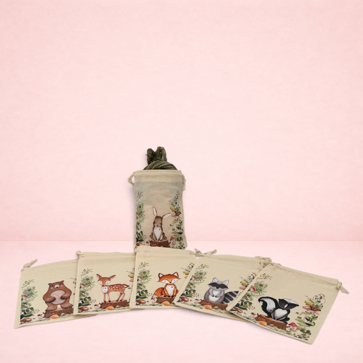 Darling Bun Shop Woodland Treat Sack collection featuring illustrated autumn animals on small beige drawstring bags.