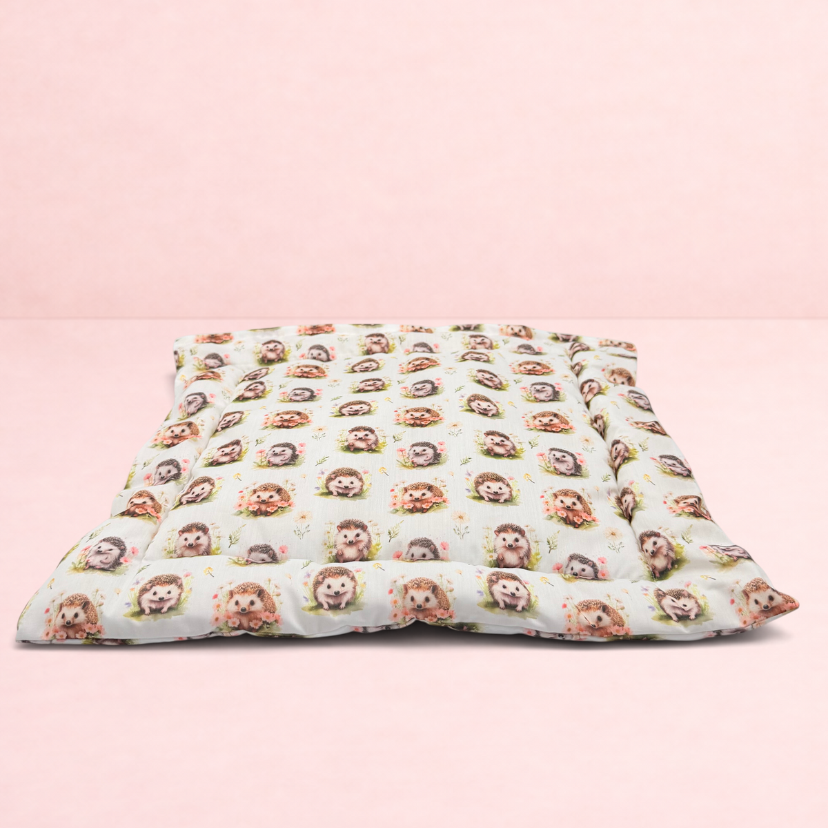 Darling Bun Shop handmade pet cushion with an autumnal hedgehog pattern on a soft cream fabric