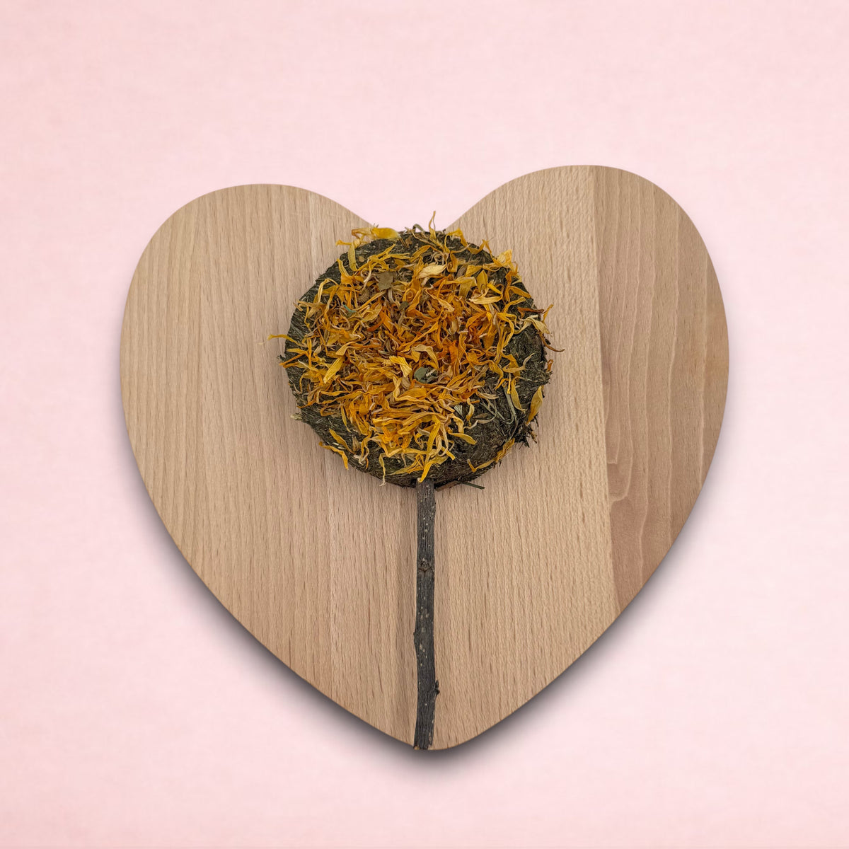 Darling Bun Shop hay-based marigold lolly treat with dried flower petals on an apple wood stick for small animals
