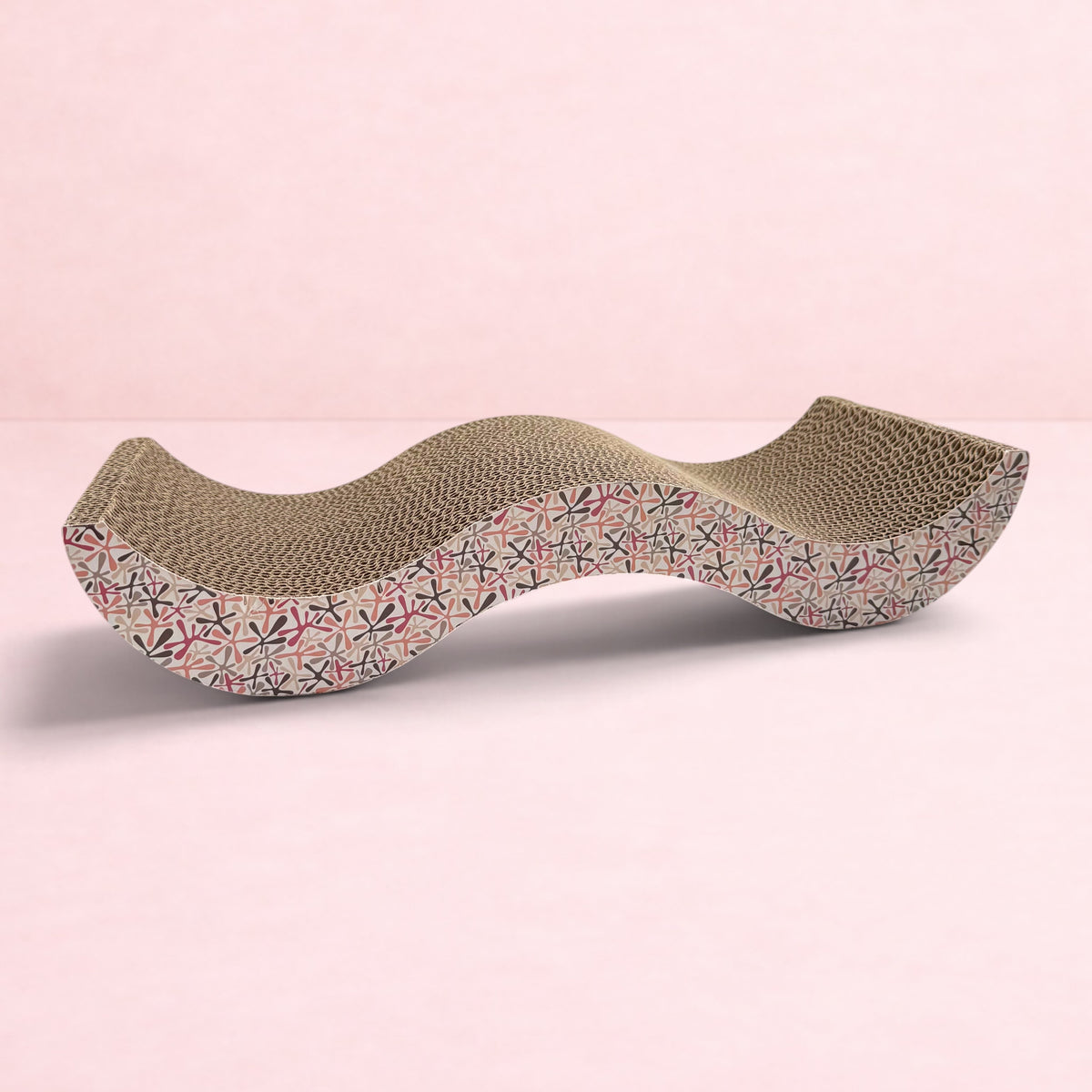 Darling Bun Shop pink patterned cardboard scratching board for rabbits with a wavy design for resting and scratching