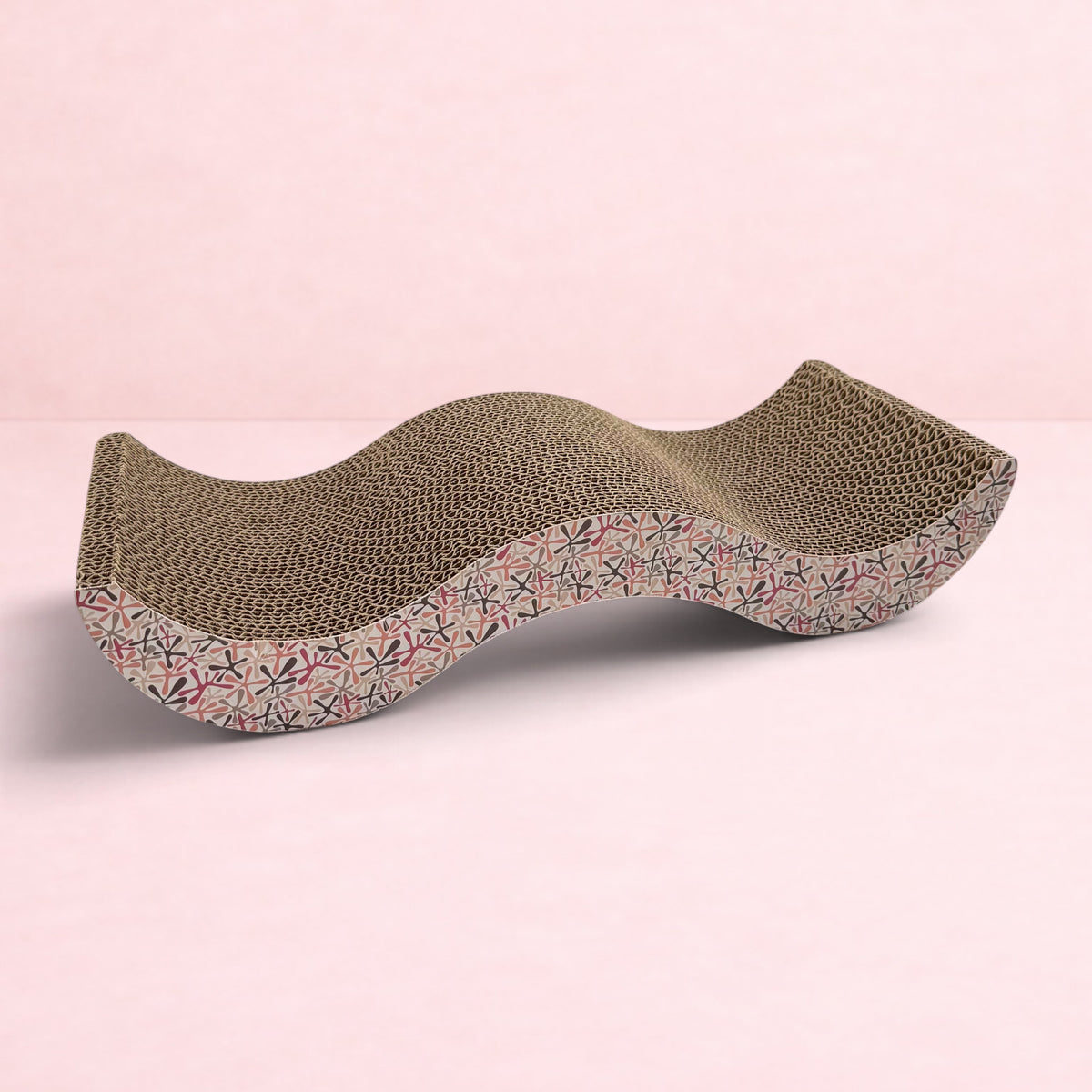 Darling Bun Shop pink patterned cardboard scratching board for rabbits with a wavy design for resting and scratching