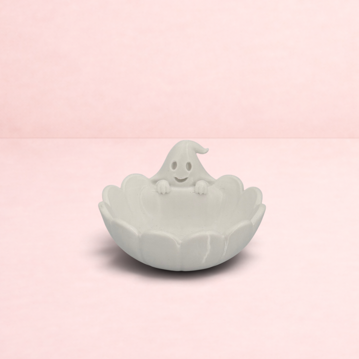 Darling Bun Shop white plastic ghost-shaped pellet bowl for small pets, perfect for Halloween treats.