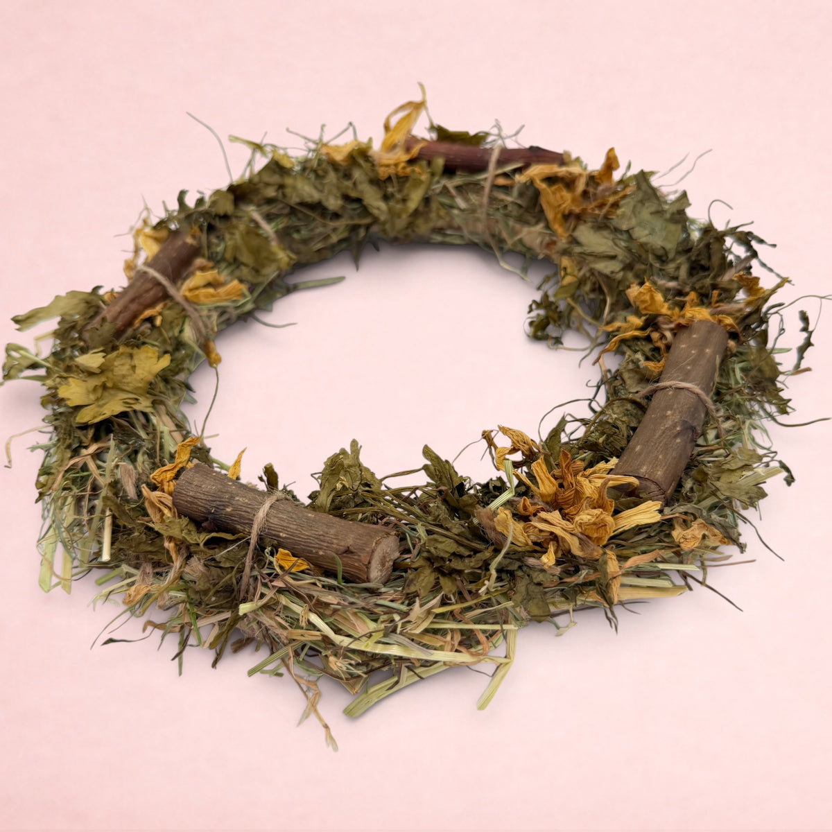 Darling Bun Shop autumn wreath made of palm leaf, timothy hay, parsley, and marigold flowers for small pets