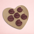 Darling Bun Shop handmade raspberry and oat bunny-shaped treats for small animals on a wooden heart board