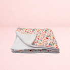 Darling Bun Shop handmade small pet blanket featuring a white background with an acorns and oak leaves floral print.