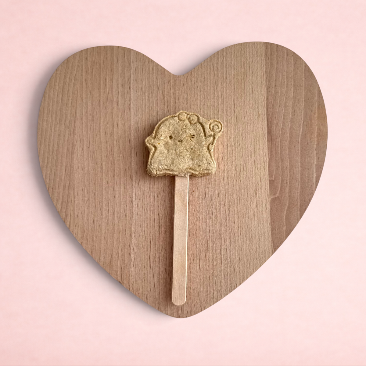 Darling Bun Shop handmade apple ghost lolly treat for rabbits on a wooden heart board