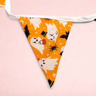 Darling Bun Shop Hoppy Haunting Bunting featuring orange fabric with cute ghost, bat, and spider Halloween print.