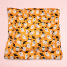 Darling Bun Shop handmade orange Halloween cushion featuring cute ghosts, bats, and pumpkins for small pets.