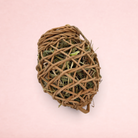 Darling Bun Shop natural vine acorn forage toy filled with timothy hay, dandelion leaves, and crunchy pea flakes.