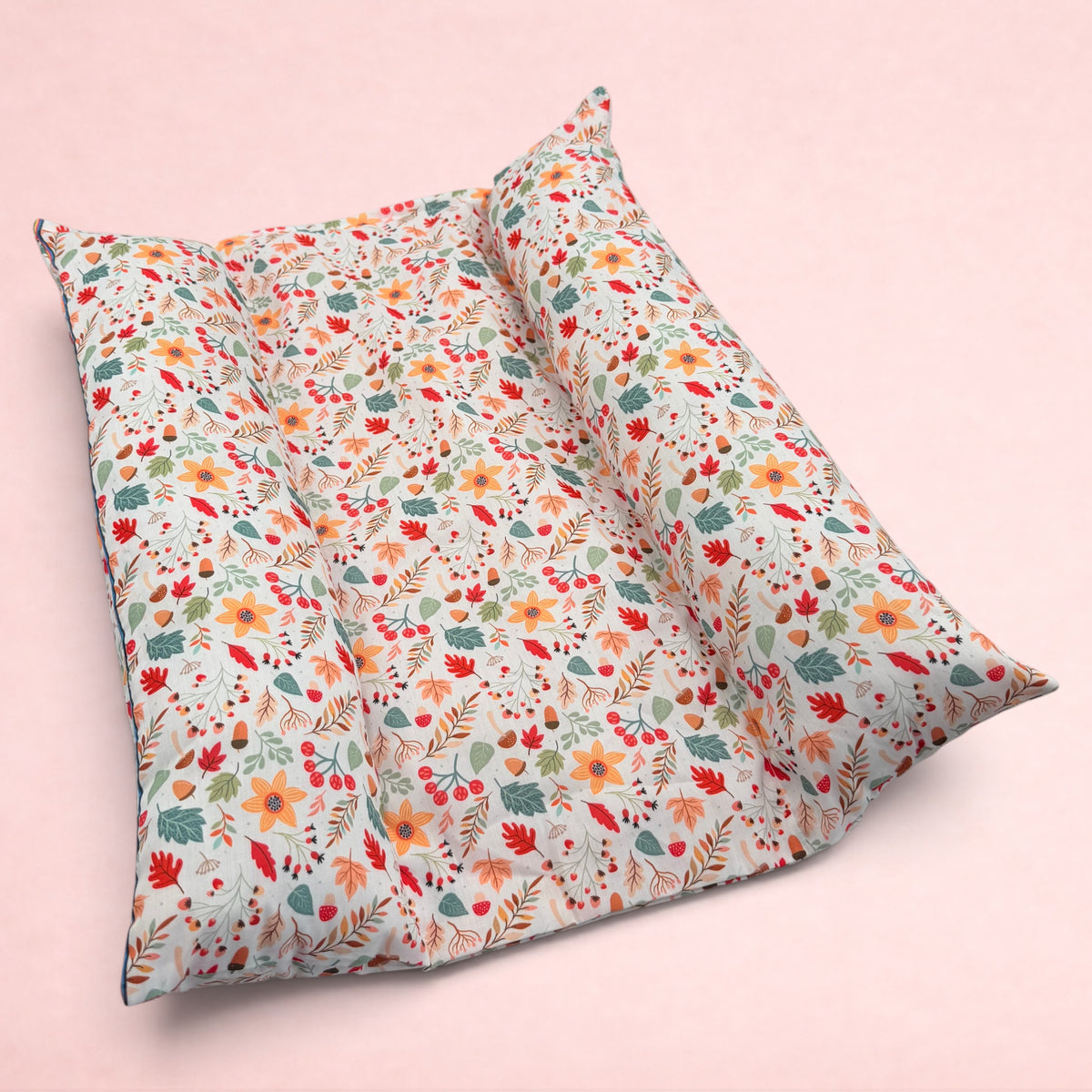 Darling Bun Shop handmade rabbit bed with autumn acorn and oak leaf print and raised pillow sides for comfort.