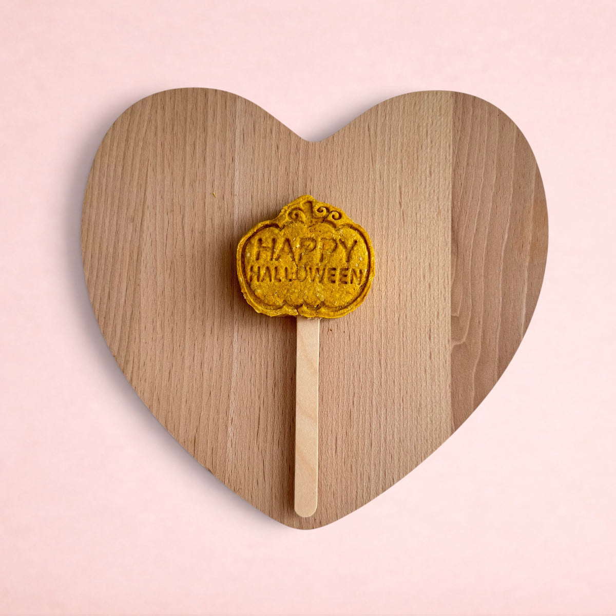 Darling Bun Shop handmade pumpkin-shaped Halloween lolly for small pets made from natural butternut squash and oats
