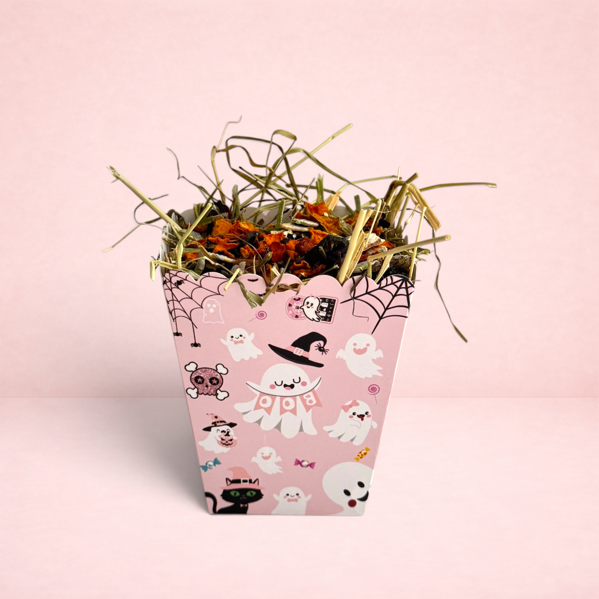 Darling Bun Shop pink Halloween snack box for small pets, filled with timothy hay, pumpkin spice forage, and flakes.