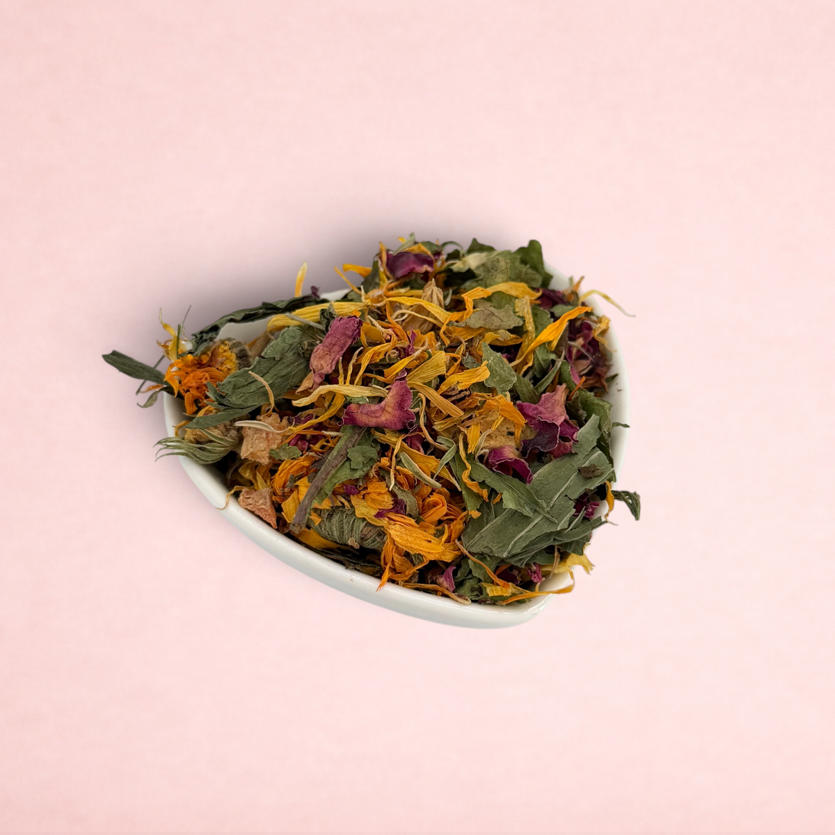 Darling Bun Shop Bunny Bouquet forage blend with dried flowers, herbs, and vegetables in a heart-shaped bowl