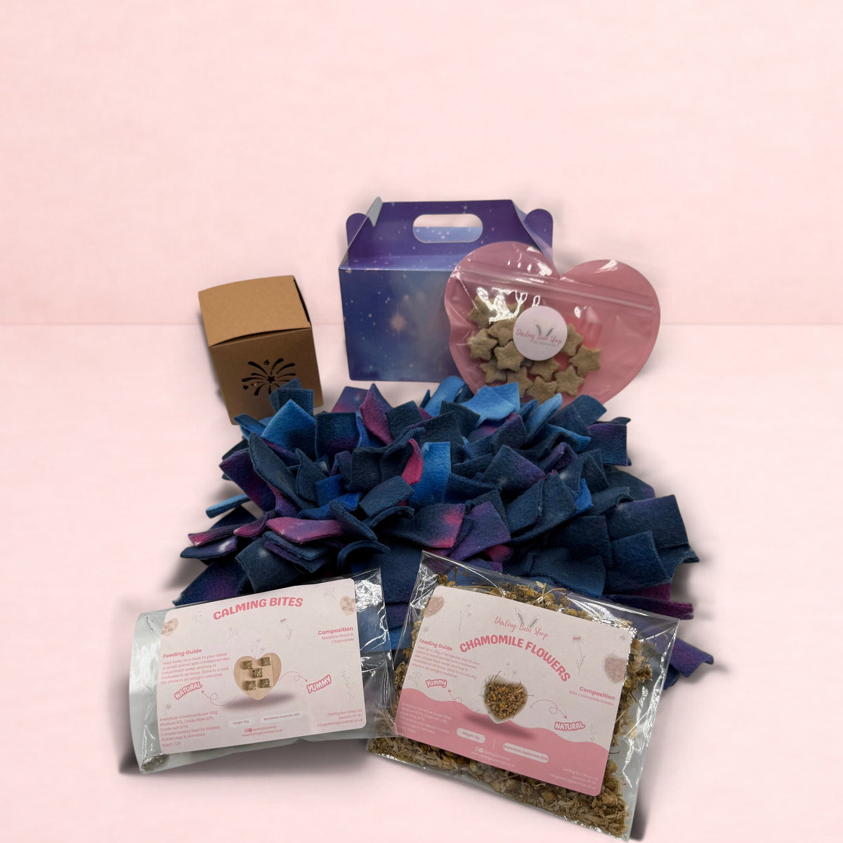 Darling Bun Shop Calming Bonfire Bundle with galaxy snuffle mat, chamomile flowers, calming bites, and rabbit treats.
