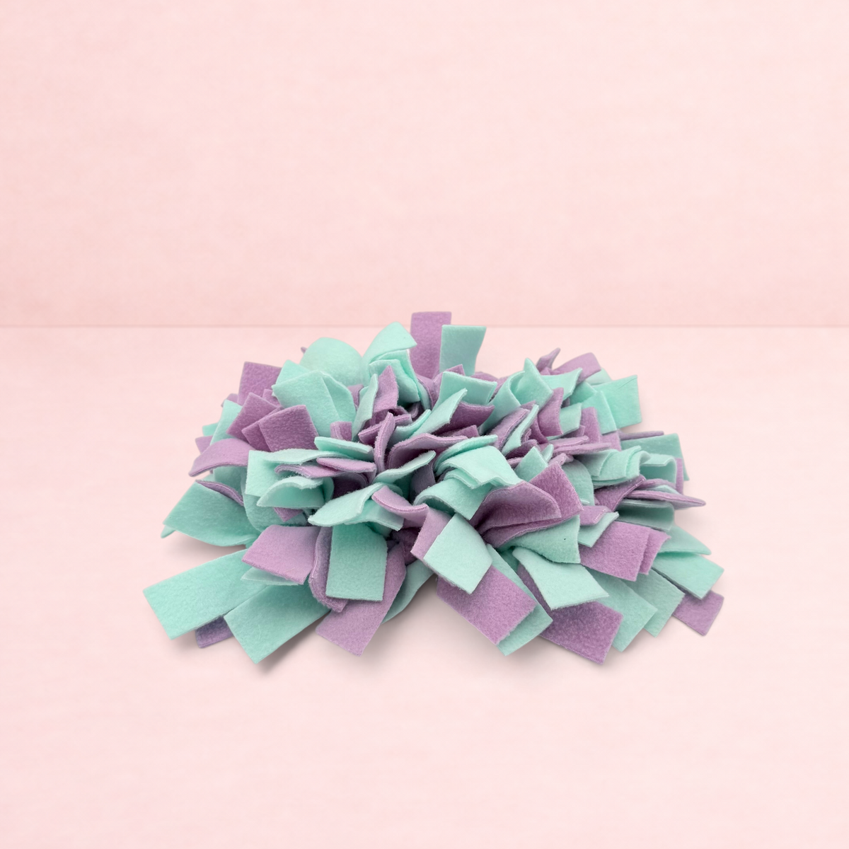 Darling Bun Shop green and purple felt snuffle mat for small pets to forage for treats and slow down eating