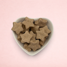 Darling Bun Shop calming banana and lavender oat star treats served in a white heart-shaped bowl.