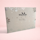 Darling Bun Shop 24-day hay-based treat advent calendar for small pets with silver snowflake and Merry Christmas design