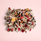 Darling Bun Shop Autumn Spice Snuffle Mat with colourful fabric strips for rabbit and guinea pig foraging enrichment.
