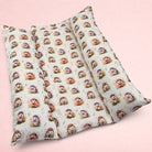 Darling Bun Shop Autumnal Hedgehogs Snuggle & Flop Bed with raised sides for rabbits in a soft cream fabric print.