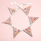 Darling Bun Shop bunting with autumn acorn and oak leaf print on fabric flags for rabbit or guinea pig enclosures.
