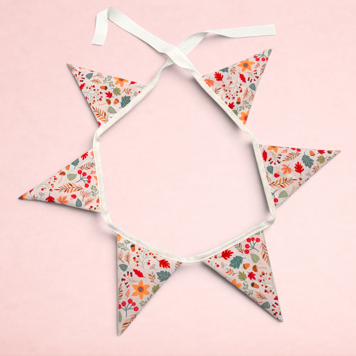 Darling Bun Shop bunting with autumn acorn and oak leaf print on fabric flags for rabbit or guinea pig enclosures.