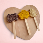 Darling Bun Shop handmade Halloween lollies for small pets, featuring bat, pumpkin, and owl shapes on wooden sticks.