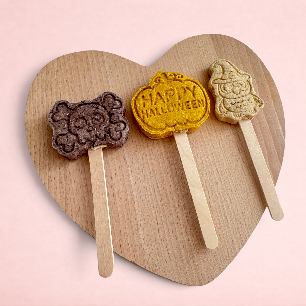 Darling Bun Shop handmade Halloween lollies for small pets, featuring bat, pumpkin, and owl shapes on wooden sticks.