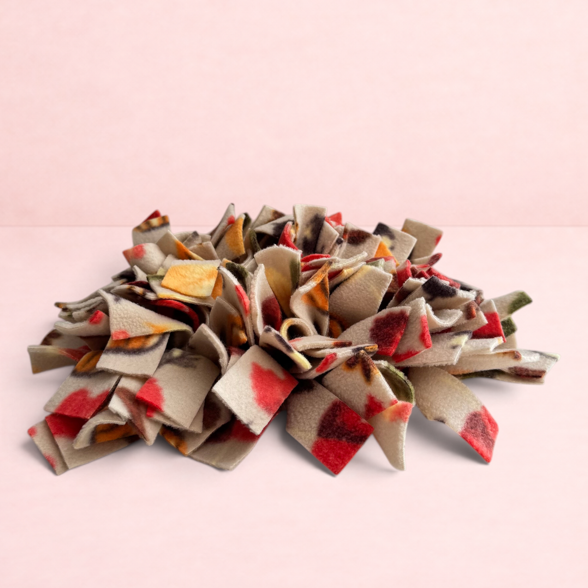 Darling Bun Shop Autumn Spice Snuffle Mat with colourful fabric strips for rabbit and guinea pig foraging enrichment.