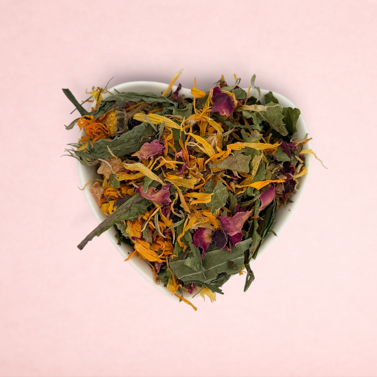 Darling Bun Shop Bunny Bouquet forage blend featuring dried marigold, rose, hibiscus, and herbs in a heart-shaped bowl