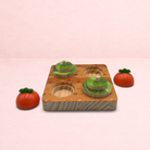 Darling Bun Shop wooden veg patch puzzle toy with carrot-shaped domes for rabbit foraging and treat enrichment