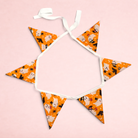 Darling Bun Shop Hoppy Haunting Bunting with orange fabric featuring ghost and witch hat patterns for small pets