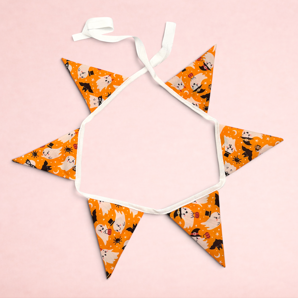 Darling Bun Shop Hoppy Haunting Bunting with orange fabric featuring ghost and witch hat patterns for small pets