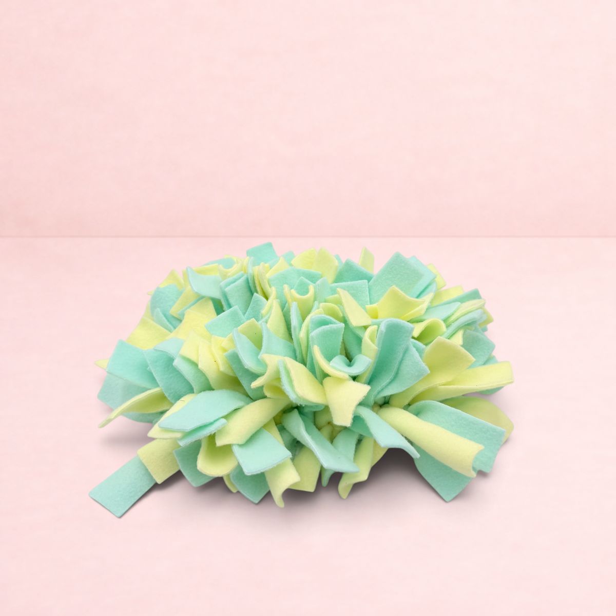 Darling Bun Shop yellow and green felt snuffle mat for small pets to forage for treats and slow down eating