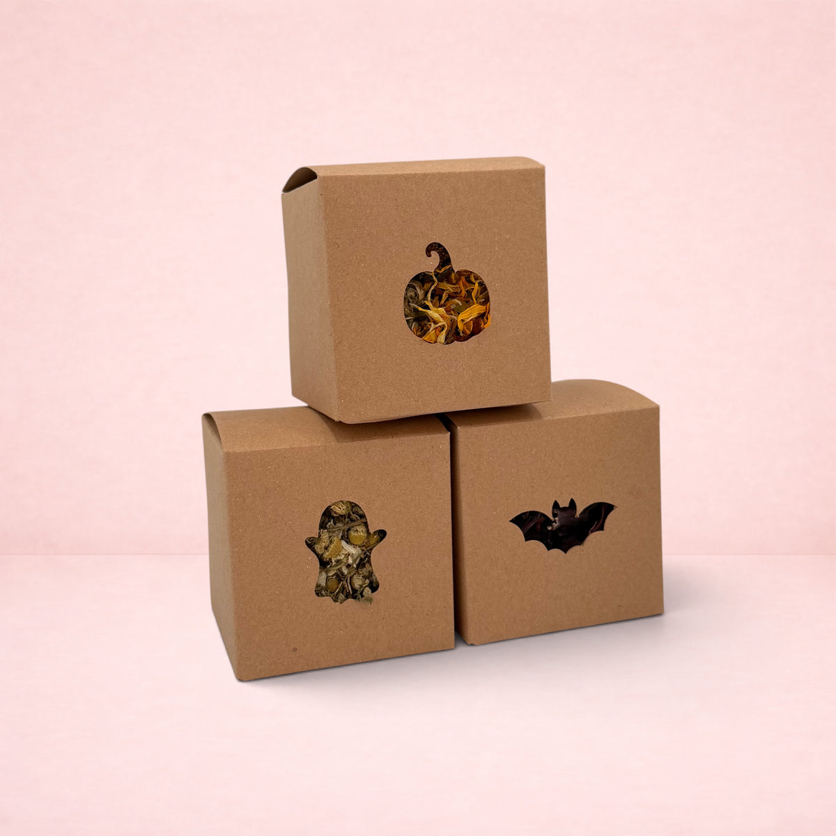 Darling Bun Shop Halloween boredom breaker boxes with pumpkin, ghost, and bat cut-outs filled with dried forage.