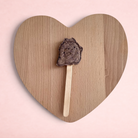Darling Bun Shop handmade blueberry ghost lolly treat for small pets on a wooden heart-shaped board