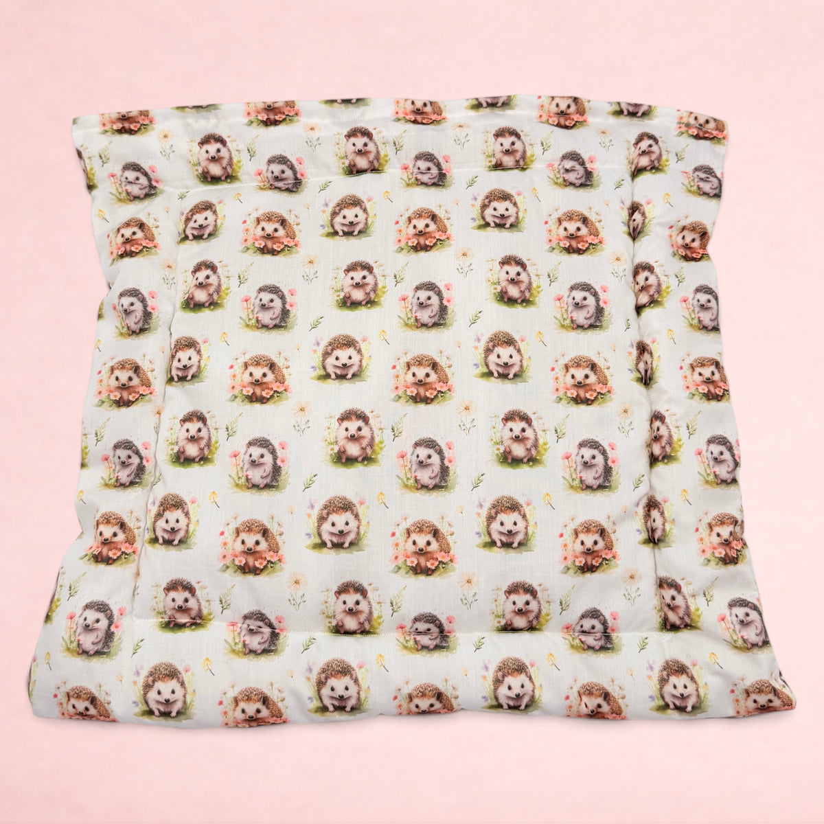 Darling Bun Shop handmade square pet cushion featuring an autumnal hedgehog pattern on a soft cream background.