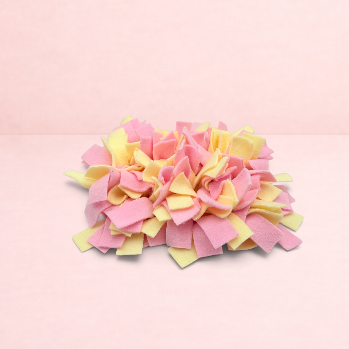 Darling Bun Shop pink and yellow felt snuffle mat for small pets to forage for treats and slow down eating