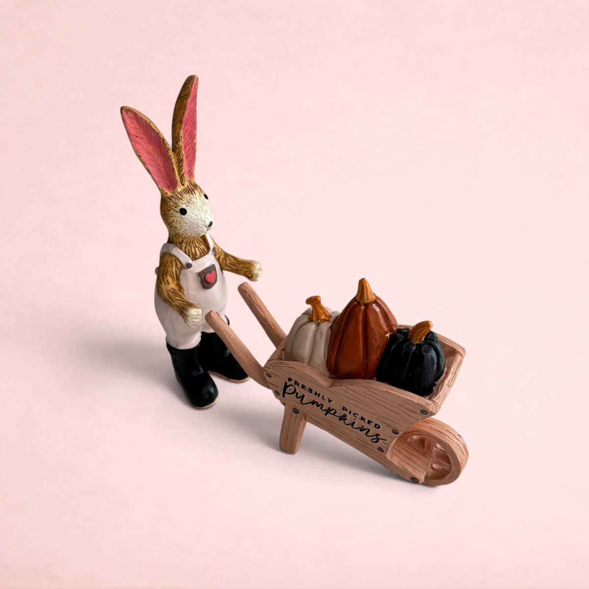 Darling Bun Shop handmade bunny ornament wearing overalls pushing a wooden wheelbarrow filled with three pumpkins