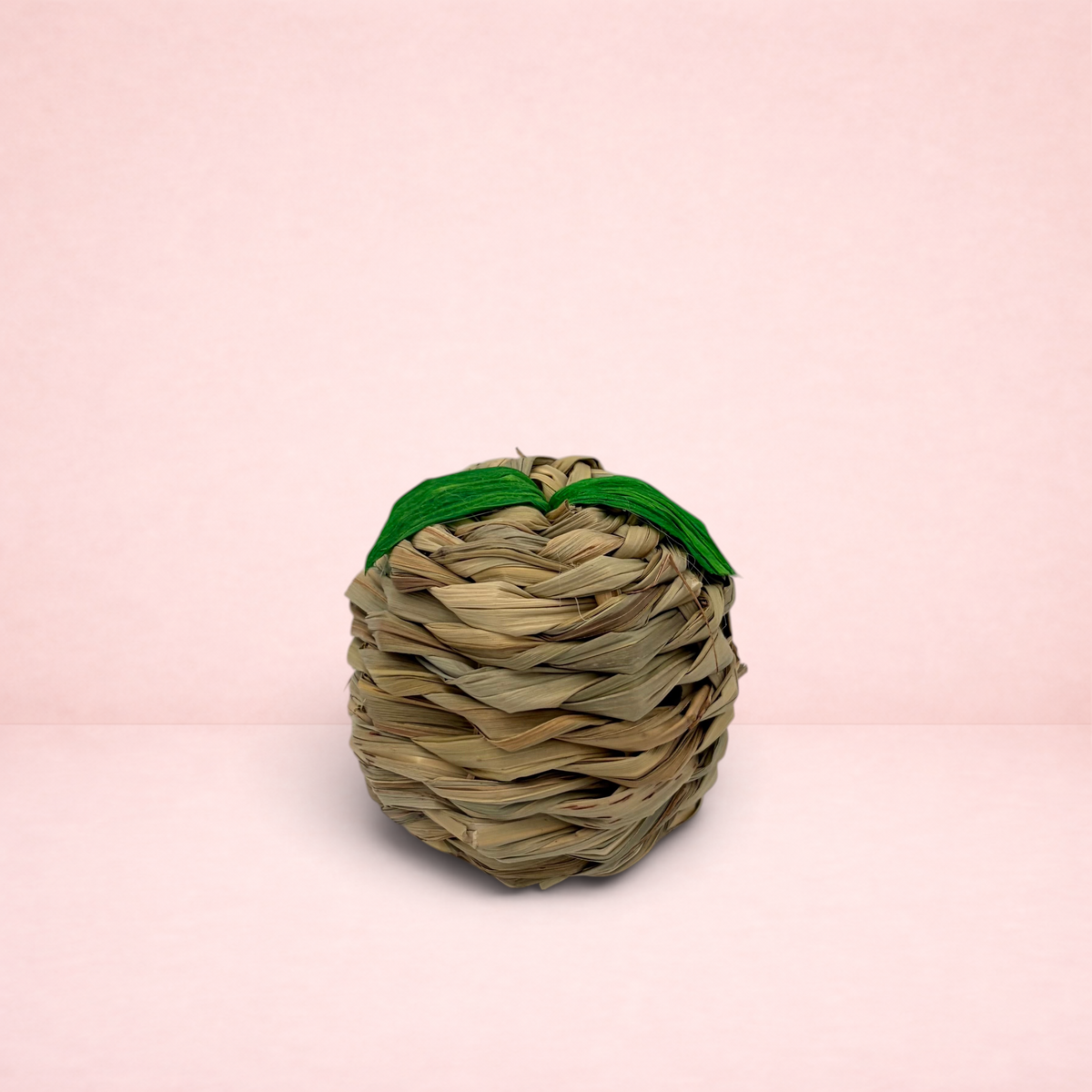 Darling Bun Shop apple-shaped toy for small animals made from woven natural seagrass and maize leaf with green leaves