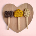 Darling Bun Shop handmade Halloween lollies for small pets, featuring blueberry bat, pumpkin, and apple owl shapes.