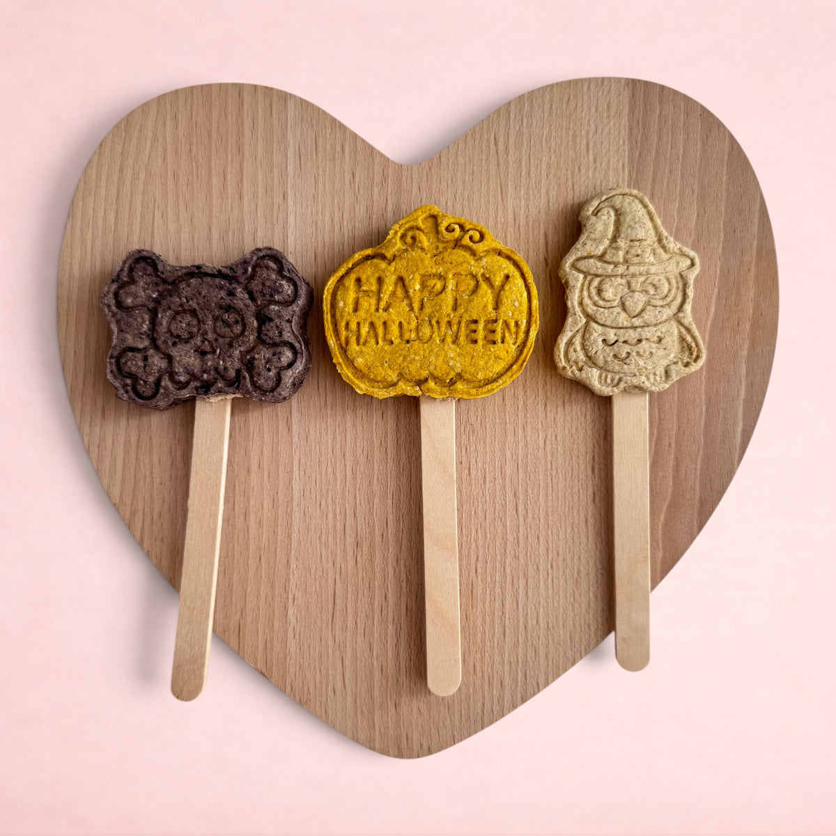 Darling Bun Shop handmade Halloween lollies for small pets, featuring blueberry bat, pumpkin, and apple owl shapes.