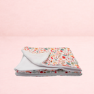 Darling Bun Shop handmade small animal blanket with an autumn acorn and oak leaf print and soft white fleece lining.
