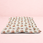 Darling Bun Shop handmade pet cushion with an autumnal hedgehog pattern on a soft cream fabric
