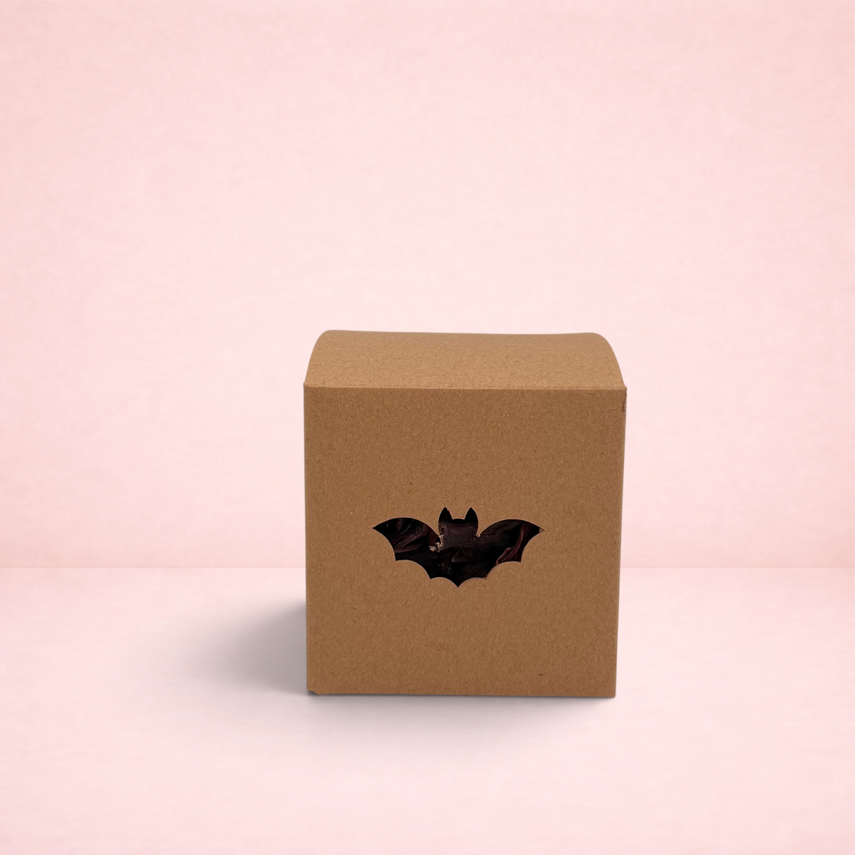 Darling Bun Shop Halloween bat-shaped boredom breaker toy for small pets made from brown cardboard with forage filling