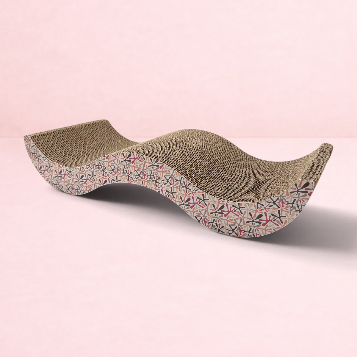 Darling Bun Shop pink patterned cardboard scratching board for rabbits with a wavy design for resting and scratching